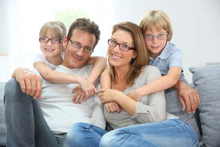 29377900 - portrait of happy family of four wearing eyeglasses